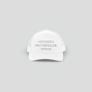 White cap with 'MAISON ANTONIUS PARIS' text on a gray background